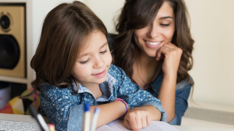 Mother helping child with homework