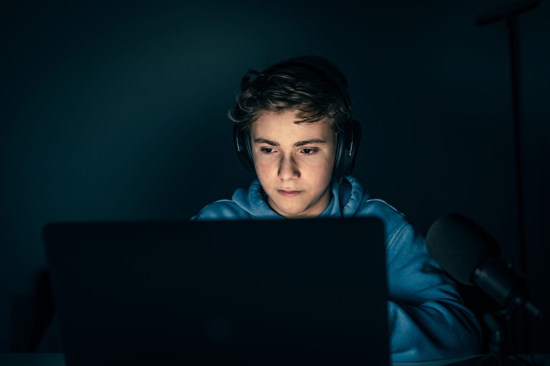 young-blogger-video-game-streamer-playing-with-laptop-vlogger-having-fun-using-technology