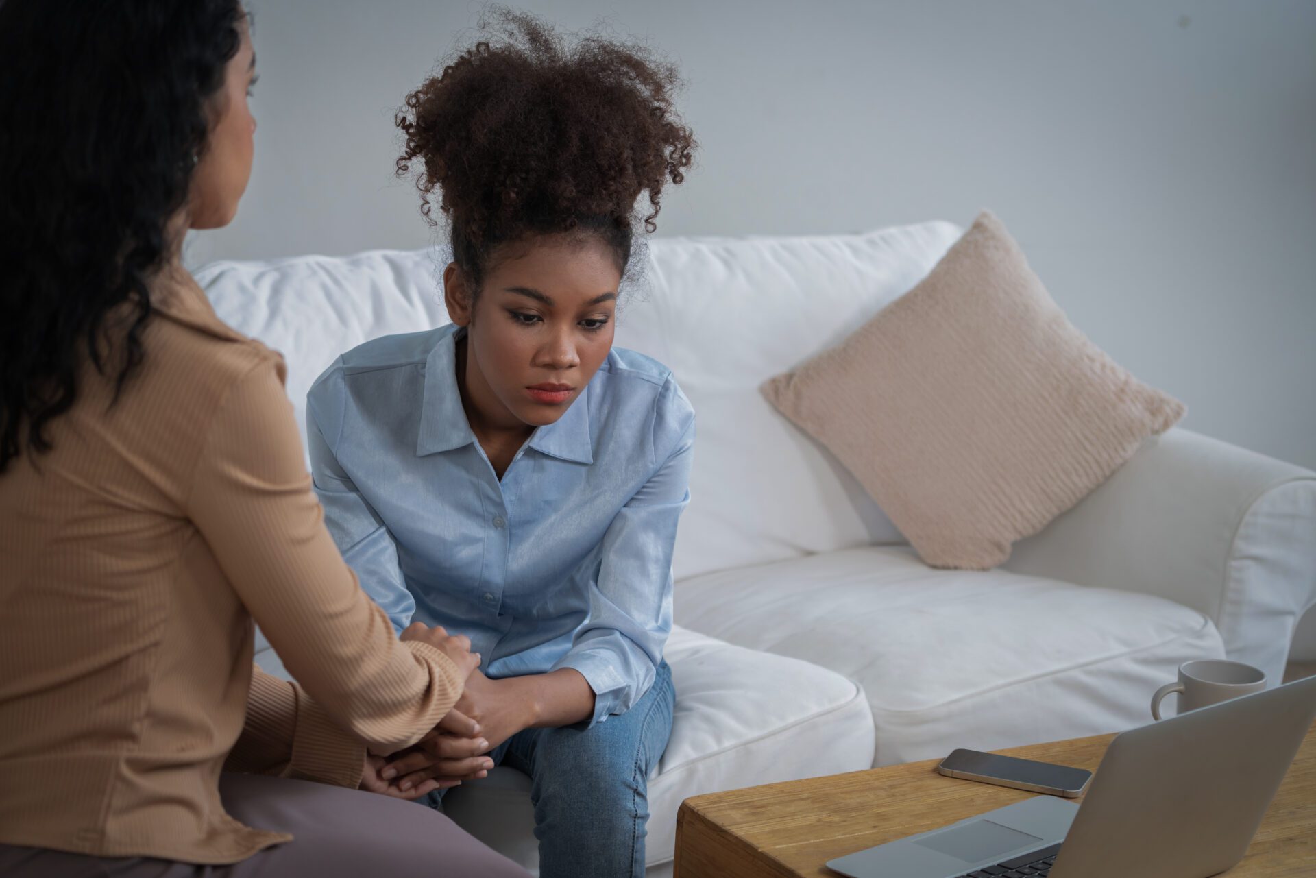 Sad PTSD woman patient in crucial therapy for mental health with psychologist